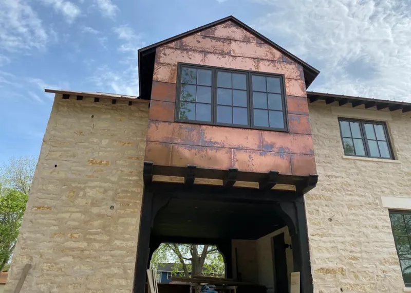 Copper metal panel facade on a stone building for Metal Roof Coating in Dearborn